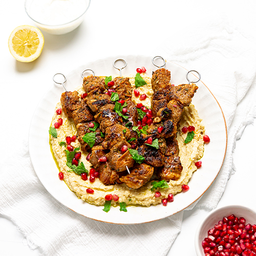 BBQ lamb skewers with hummus and mint